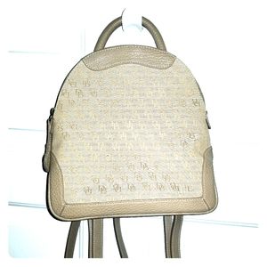 My closet runneth over with designer purses.